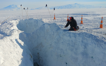 Man inspecting a crevasse